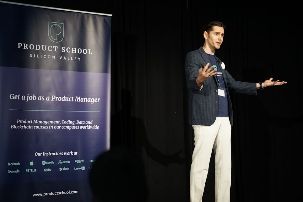 man-standing-on-stage-zfbvxclb2i8 Man on stage speaking to the audience holding his hands out.
Carlos Gonzalez de Villaumbrosia, CEO and Founder Product School speaking at ProductCon San Francisco.